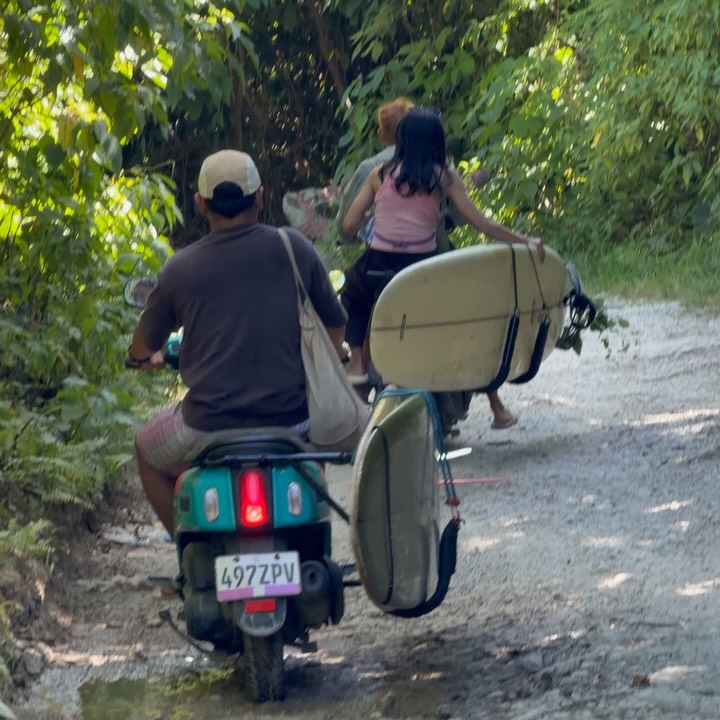 Motorcycles loaded with surfboards on Siargao roads